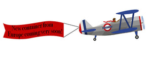 Cartoon Airplane with Banner that says "New container from Europe coming very soon!"