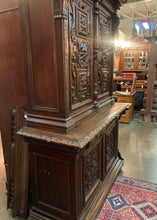 Large Carved Cabinet with Faces