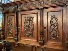 Close up of Carving on Doors on Belgium Hunting Cabinet
